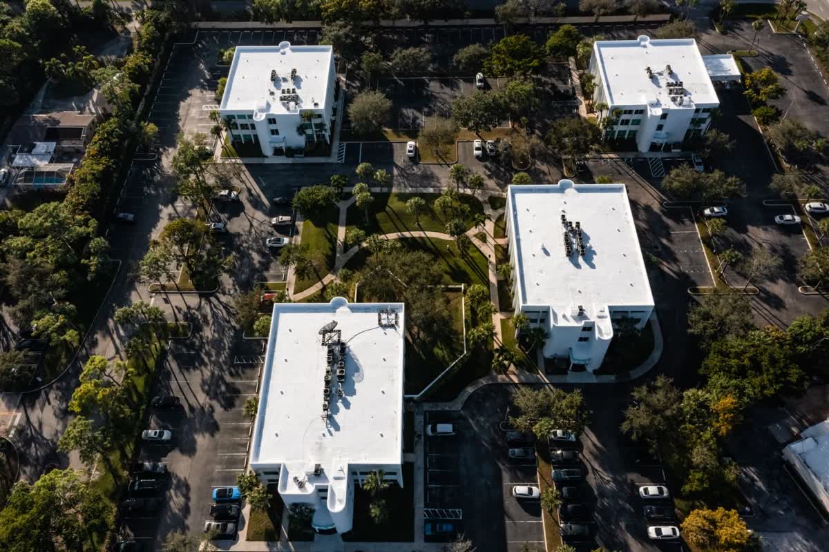 Aerial view of an office complex with maintained flat roofs