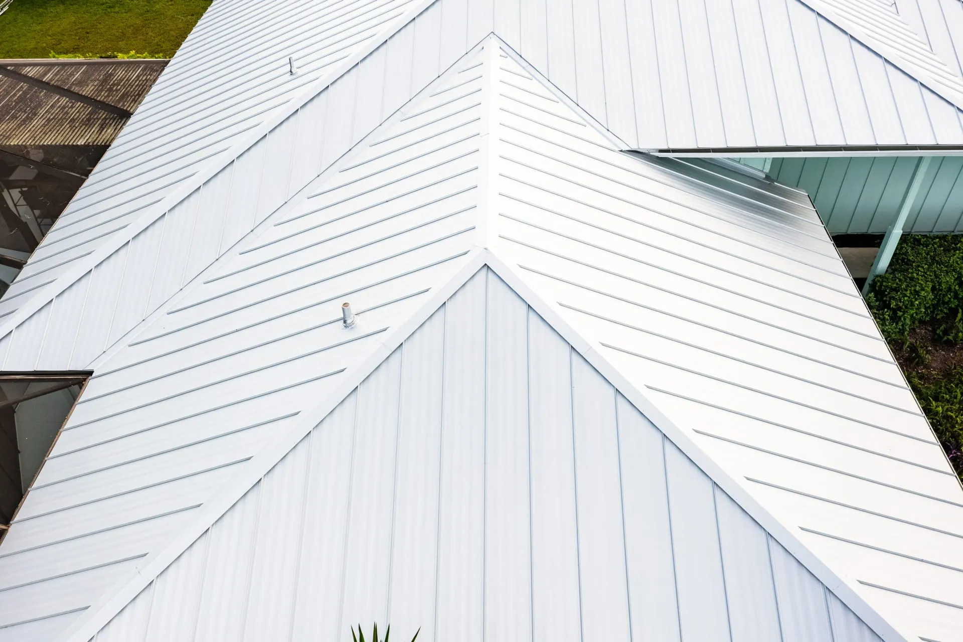 Close-up of a reflective white standing seam metal roof