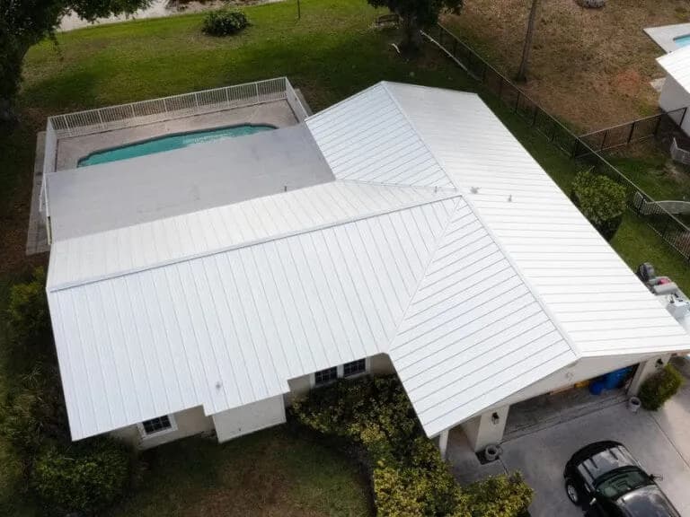 Aerial view of a white standing seam metal roof