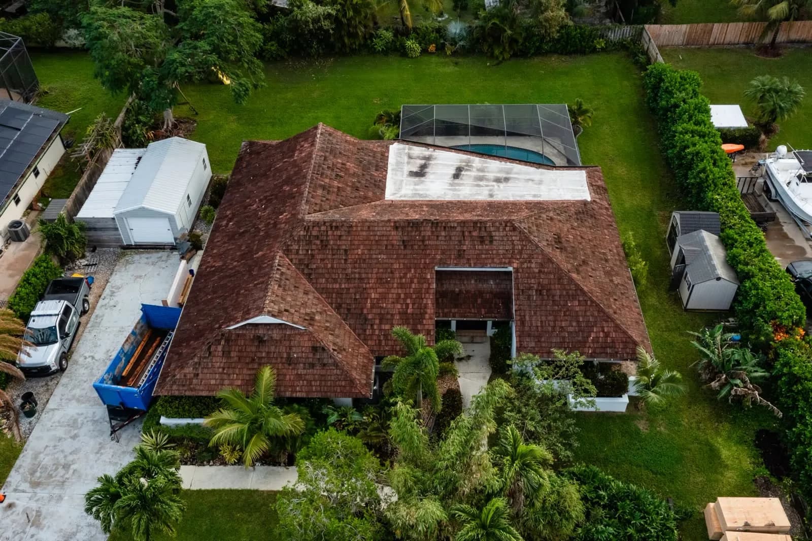 Aerial view of a weathered tile roof due for repair or replacement