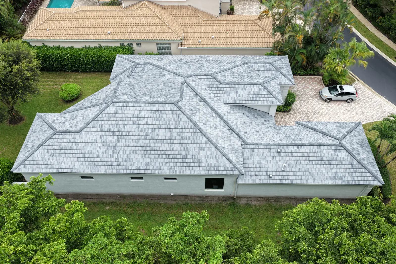 Aerial view of a finished gray tile re-roof