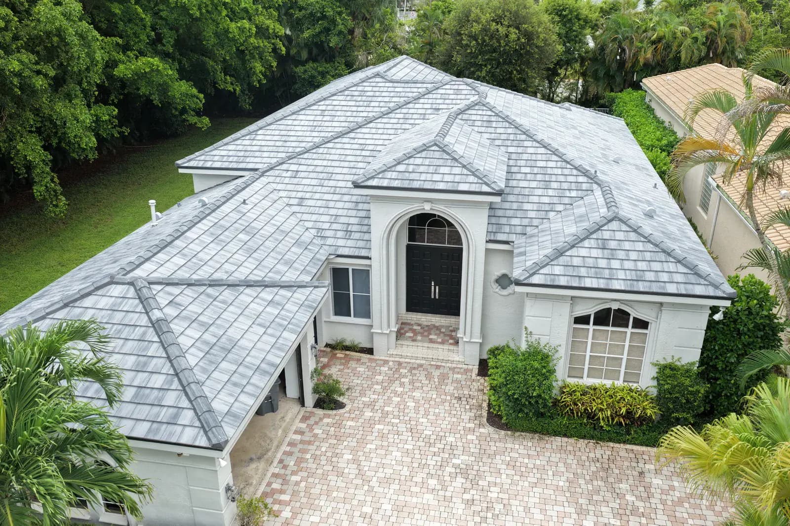 Gray tile re-roof completed on a single-story home