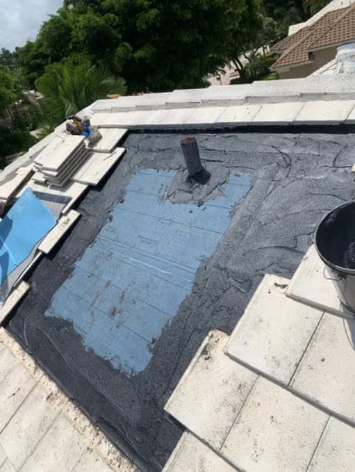 Flat roof membrane repair on a home next to a pool