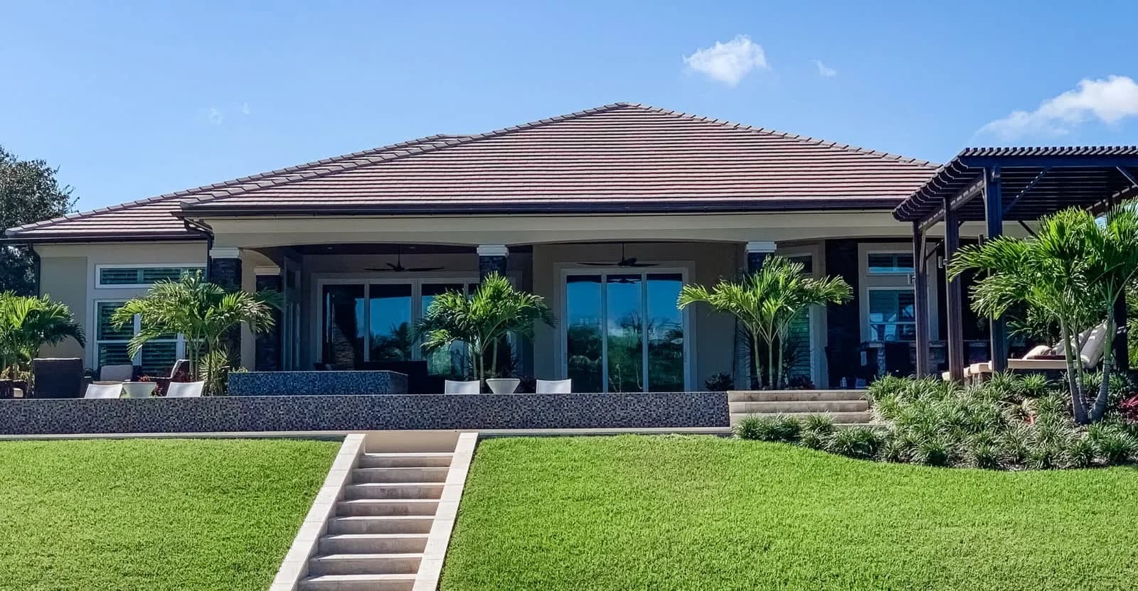 Luxury home with a tile roof at golden hour