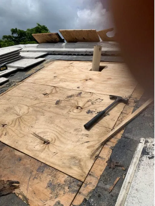 Roof deck repair with plywood sheathing and rafters exposed