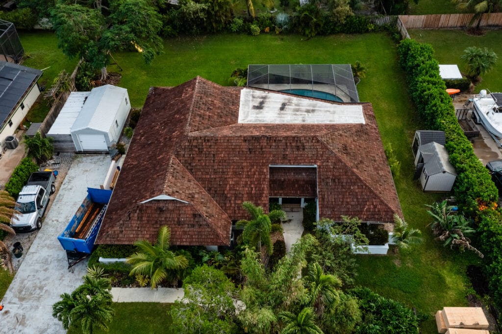 Aerial view of a worn roof in Stuart, FL before replacement