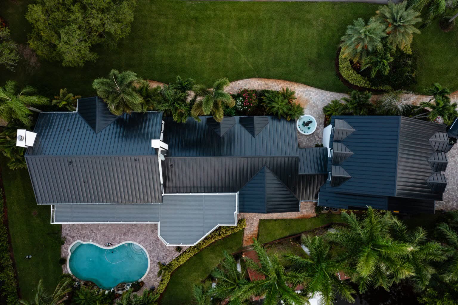 Aerial view of a completed metal roof installation in Jupiter, FL by All-Type Roofing Services